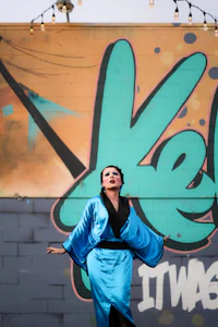 a woman in a blue kimono