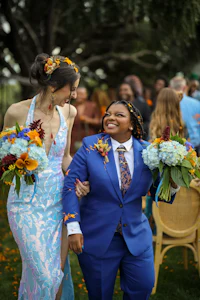 a woman in a blue suit and a man in a blue suit