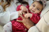 a woman holding a baby in her arms