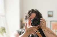 a woman taking a picture with her camera