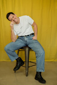 a man sitting on a stool